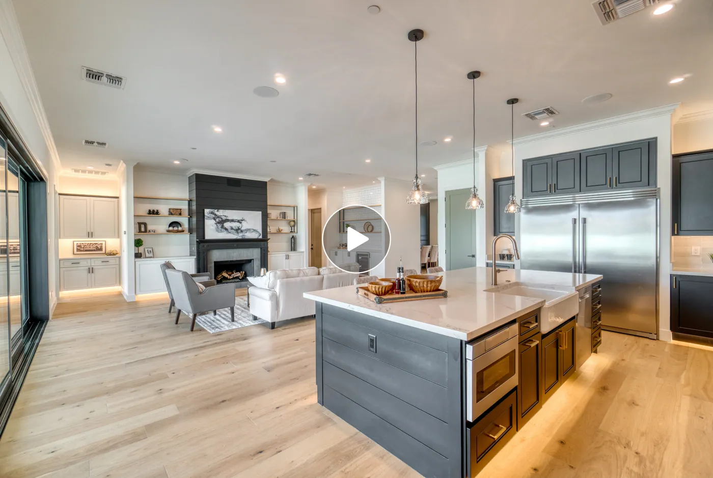Premium property video preview showing a bright open kitchen and living area